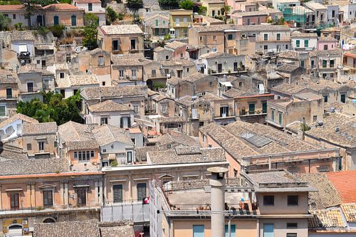 Idyllic view of Italian town with grey roofs on hill