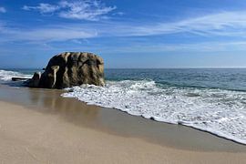 A striking boulder on the shallow shoreline by Theodor Decker