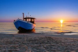 Blue boat made of wood on the beach of the Baltic Sea by Tilo Grellmann