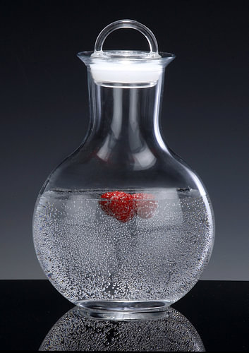 Water carafe with raspberries