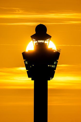 Sunset behind schiphol's control tower. by Arthur Bruinen