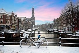 Snow-covered Amsterdam with the Westerkerk in winter in the Netherlands at sunset by Eye on You