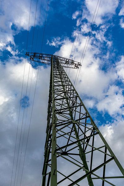 Power pole under cloudy sky by Oliver Hlavaty