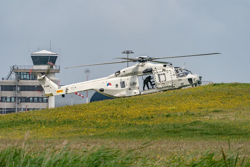 An NH-90 helicopter on the slopes at De Kooy Maritime Air Station. by Jaap van den Berg
