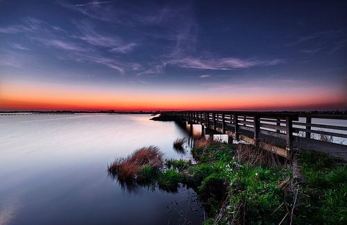 Wooden bridge to sunset