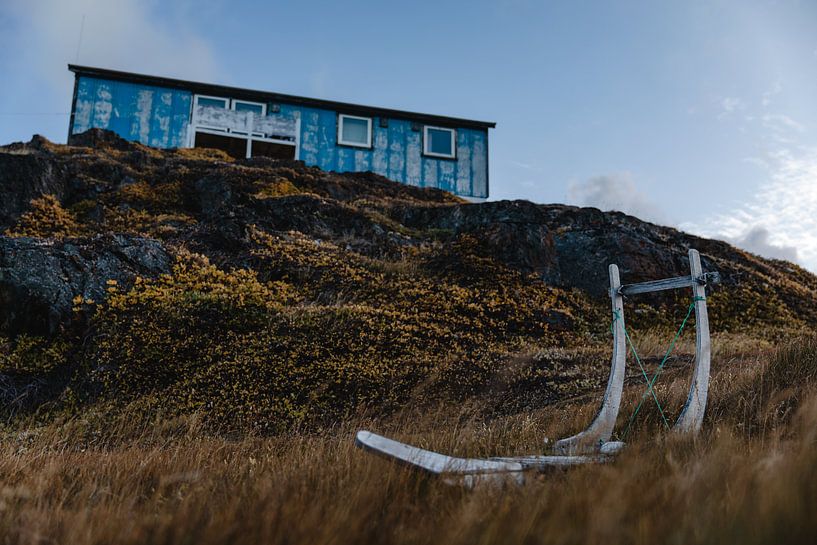 Dog sled in a village in Greenland by Martijn Smeets