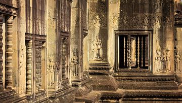 Beautiful wall in ochre yellow and brown colors with Apsaras in Angkor Wat