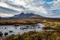 Mountain peaks Sgùrr nan Gillean with cottage and stream in foreground on Isle of Skye