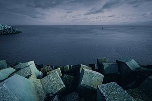 Concrete blocks protect harbor on coast (Coastline) by Rick Van der Poorten