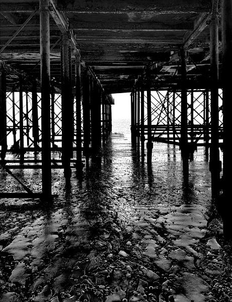 Under a pier South England black and white by . Groningenart