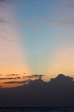 Blue beam in the sky at sunset