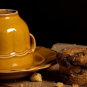 Still life yellow cup with a delicious biscuit by Arendina Methorst