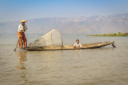 Traditional Burmese fisherman and kid
