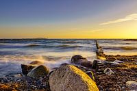 Beach of Dranske on Rügen with view to the island Hiddensee at sunset (landscape)