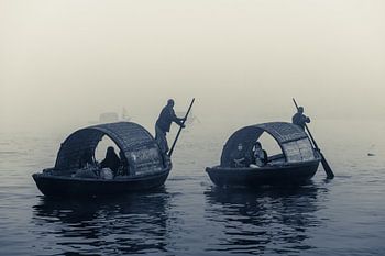 Black and white photography with boats on the river in morning fog