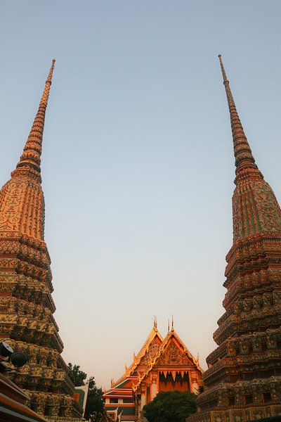 Part view from two stupa against clear sky at Wat Pho Buddha temple. by kall3bu