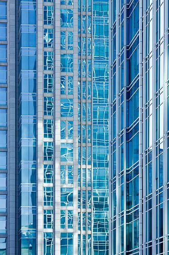 Reflection in glass surface of a skyscraper