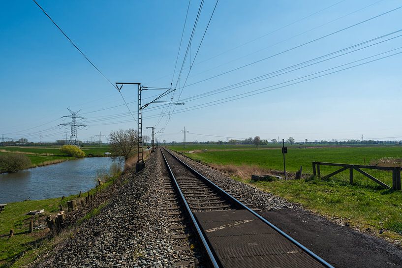 Lonely train track through the countryside by Matthias Korn