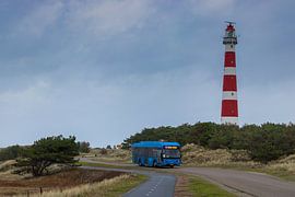Ameland lighthouse with an electric bus in the dune landscape by Arthur Scheltes