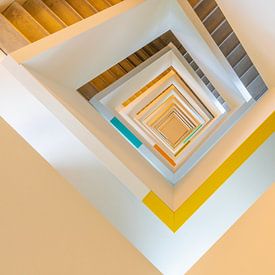 Looking down at a colourful stairwell by Bob Janssen