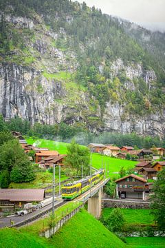 Yellow Flash: Train journey through Lauterbrunnens Natural Beauty by Bart Ros