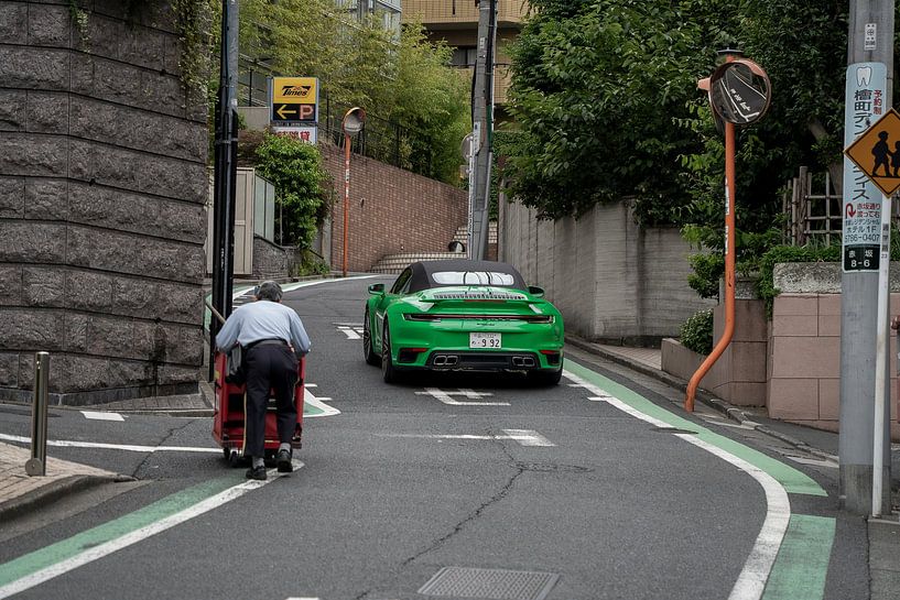 The contrast, Porsche 911 and postman by The Wandering Piston
