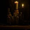 Still life with candles and bottles by Theo Felten