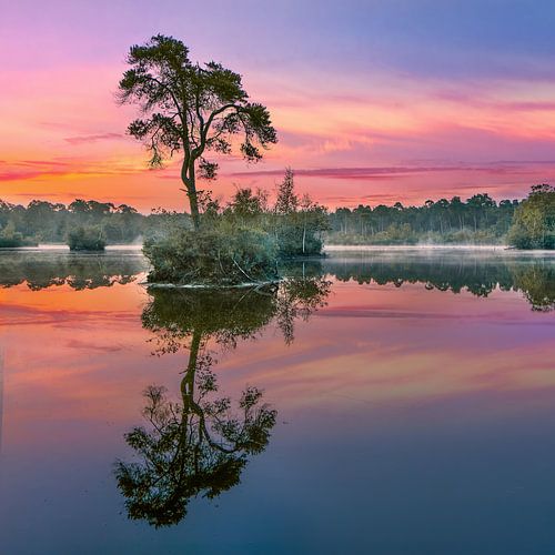 Red and turquoise sunrise reflected in a lake_1