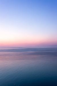 kleurrijke lucht in de avond aan zee van Karijn | Fine art Natuur en Reis Fotografie