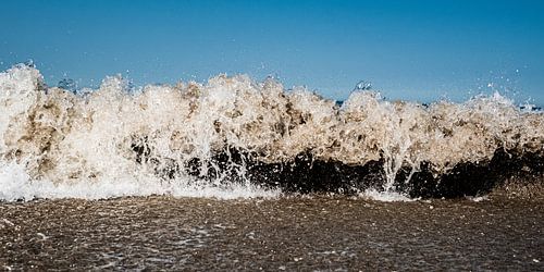 The raging sea captured as a wall as if time stood still