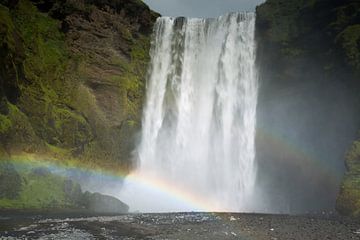 Skogafoss waterfall with rainbow in Iceland by Menno Schaefer