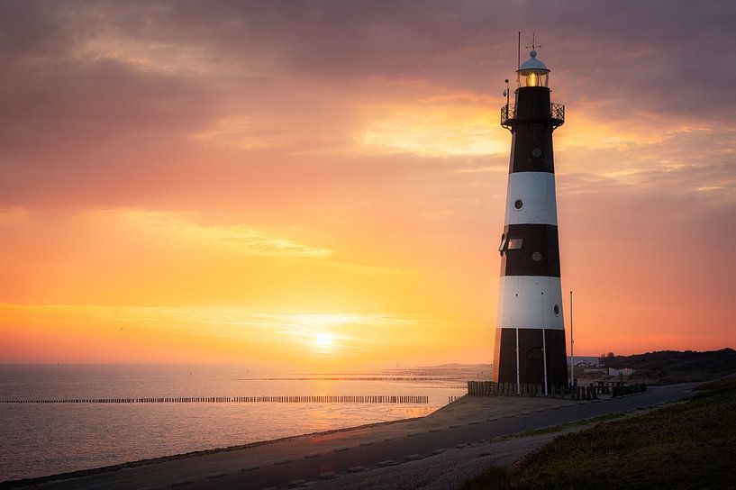 Warm sunrise lighthouse Breskens by Thom Brouwer