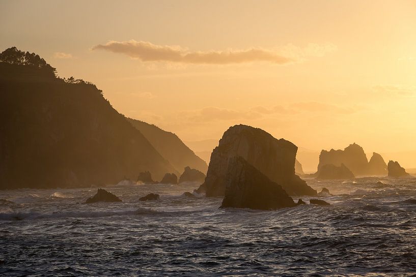 Sunset on a rugged rocky coastline by Peter Haastrecht, van