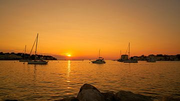 romantic sunset at the coast of the harbour town Porec at the Adriatic Sea by Heiko Kueverling