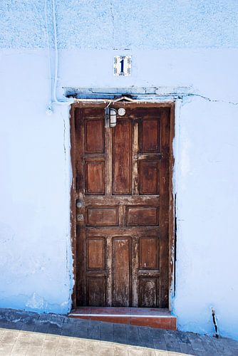 old door in blue wall