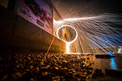 Lightpainting work along the waterfront under viaduct