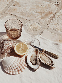 Oysters, Lemon and Glasses on Stone – Seaside Still Life by StudioRemier