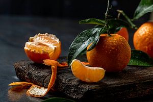 fresh tangerines on dark background by Olha Rohulya