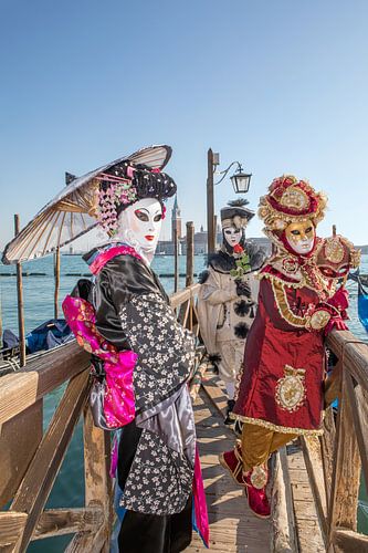 Carnival in Venice - Costumes in front of the gondolas on St Mark's Square