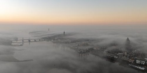 The city front of Kampen in the mist by Evert Jan Kip