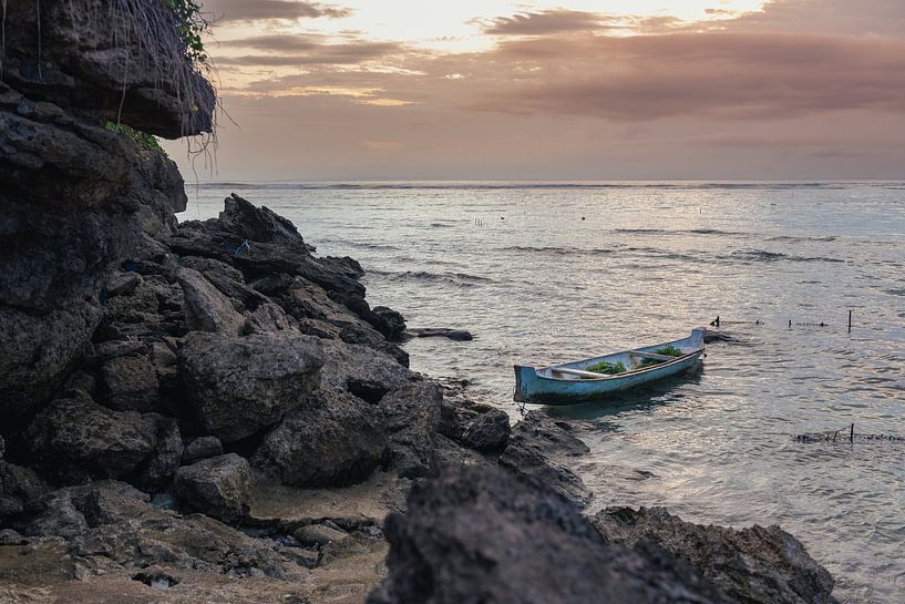 Boat in the sea during sunset by Perry Wiertz