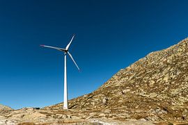 Wind turbine in front of a blue sky by Conny Pokorny