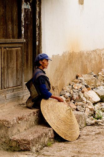 Femme chinoise avec un chapeau de riz