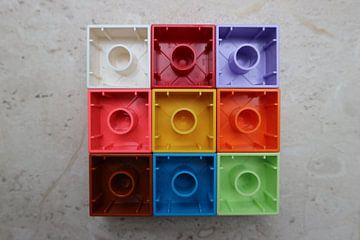 Nine (9) square toy blocks lying upside down colourful (rotation 3)