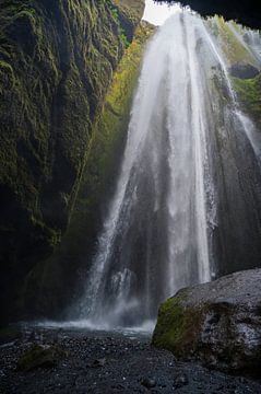 Waterfall in a cave in Iceland by Tim Vlielander