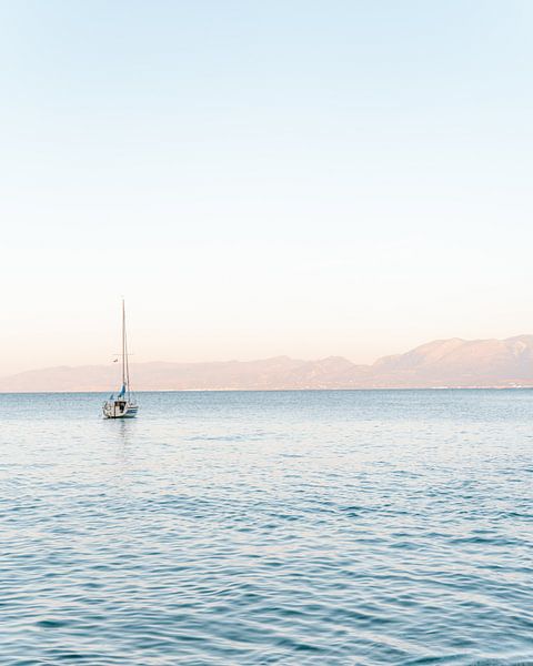 Boat at sunset in Greek sea - travel photography - Fine art photography by Kaylee Burger