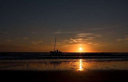 catamaran at sea at sunset