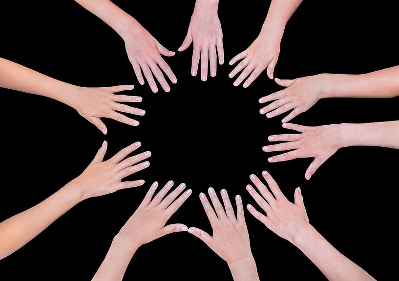 Hands of five girls together in circle isolated on black background by Ben Schonewille