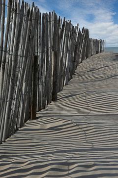 Wooden poles on the beach of Cadzand Zeeland by Albert Brunsting