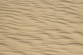 Wellen im Sand von Bram Tempelaar Photography